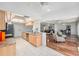 Bright kitchen with stainless steel appliances, tile backsplash, hardwood floors, and an open floor plan at 2222 Westchester Blvd, Spring Hill, FL 34606