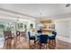 Open-concept space with dining area, living room, and natural light from backyard at 2222 Westchester Blvd, Spring Hill, FL 34606