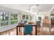Bright and airy living room with large windows, hardwood floors, and an open floor plan with a dining area at 2222 Westchester Blvd, Spring Hill, FL 34606