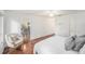 Cozy main bedroom featuring hardwood floors, a door to the kitchen, and closet space at 2222 Westchester Blvd, Spring Hill, FL 34606