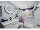 Updated bathroom featuring a sleek vanity, black fixtures, a new shower, and patterned floor tiles at 2329 Carrie Ct, Dunedin, FL 34698