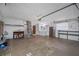 Spacious garage features a washer, dryer, refrigerator and ample room for storage or workshop activities at 2329 Carrie Ct, Dunedin, FL 34698