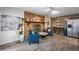 Cozy living room showcasing a brick fireplace, stylish decor, wood-look tile flooring, and comfortable seating at 2329 Carrie Ct, Dunedin, FL 34698