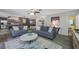 Open-concept living space featuring two comfortable sofas, modern furnishings, and stylish decor at 2329 Carrie Ct, Dunedin, FL 34698