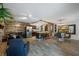 Open-concept living space with modern kitchen, dining area, and comfortable seating arrangement at 2329 Carrie Ct, Dunedin, FL 34698
