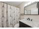 Bathroom features an updated vanity, sink, toilet, and tub shower at 2461 Rhodesian Dr # 47, Clearwater, FL 33763
