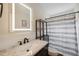Bathroom features an updated vanity, sink, and framed vanity mirror at 2461 Rhodesian Dr # 47, Clearwater, FL 33763