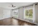 Bedroom with hardwood floors, large windows, and closet at 2461 Rhodesian Dr # 47, Clearwater, FL 33763