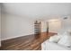 Open living space with hardwood floors, modern lighting fixture and neutral color palette at 2461 Rhodesian Dr # 47, Clearwater, FL 33763