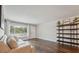 Inviting living room featuring hardwood floors and a large window with natural light at 2461 Rhodesian Dr # 47, Clearwater, FL 33763