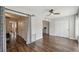 Spacious living room with hardwood floors and access to the kitchen and hallway at 2461 Rhodesian Dr # 47, Clearwater, FL 33763