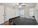Main bedroom with hardwood floors, closet, en-suite bathroom, and access to the patio at 2461 Rhodesian Dr # 47, Clearwater, FL 33763