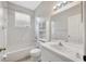 Clean bathroom with a tub-shower combination, white vanity, and ample lighting at 25101 Hyde Park Blvd, Land O Lakes, FL 34639