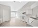 The eat-in kitchen features tiled flooring, white appliances, and a ceiling fan at 25101 Hyde Park Blvd, Land O Lakes, FL 34639