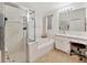 Bright bathroom with a glass enclosed shower and relaxing soaking tub at 25101 Hyde Park Blvd, Land O Lakes, FL 34639