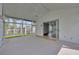 Enclosed sunroom offering ample natural light and access to the outdoors at 25101 Hyde Park Blvd, Land O Lakes, FL 34639