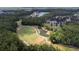 Expansive aerial view of the golf course showcasing the lush greenery and lake features at 26343 Whirlaway Ter, Wesley Chapel, FL 33544