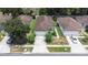 Aerial view of a home showcasing its well-maintained landscaping and a long driveway at 26343 Whirlaway Ter, Wesley Chapel, FL 33544