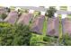 A high aerial view showcases the neighborhood with well-maintained lawns and manicured landscaping at 26343 Whirlaway Ter, Wesley Chapel, FL 33544
