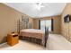 A spacious bedroom features a vaulted ceiling, a ceiling fan, and natural light at 26343 Whirlaway Ter, Wesley Chapel, FL 33544
