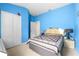 Bright bedroom featuring vaulted ceilings and an ample closet at 26343 Whirlaway Ter, Wesley Chapel, FL 33544