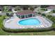 Beautiful community pool area featuring ample lounge chairs and a covered pavilion for relaxing at 26343 Whirlaway Ter, Wesley Chapel, FL 33544
