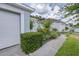 Home featuring a well-maintained lawn, driveway, and a two car garage, providing ample parking at 26343 Whirlaway Ter, Wesley Chapel, FL 33544