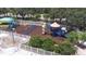 A colorful community playground with slides, swings, and a splash pad for endless fun at 26343 Whirlaway Ter, Wesley Chapel, FL 33544