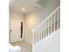 Inviting foyer with tiled flooring and a staircase leading to the upper level at 26541 Chimney Spire Ln, Wesley Chapel, FL 33544