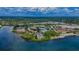 Extensive aerial view of a waterfront community with lush trees and various buildings at 2700 Bayshore Blvd # 5307, Dunedin, FL 34698