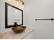 Bathroom featuring a unique bowl sink, sleek black faucet, and modern lighting at 2700 Bayshore Blvd # 5307, Dunedin, FL 34698