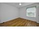 Bright, vacant bedroom with hardwood floors, a window with blinds, and a ceiling fan at 2700 Bayshore Blvd # 5307, Dunedin, FL 34698