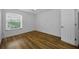This bright bedroom features laminate floors, a window, and closet at 2700 Bayshore Blvd # 5307, Dunedin, FL 34698
