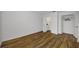 This bedroom features laminate floors, an ensuite bathroom, and closet space at 2700 Bayshore Blvd # 5307, Dunedin, FL 34698