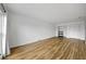 Living area featuring wood-look floors and access to a closet with bi-fold doors at 2700 Bayshore Blvd # 5307, Dunedin, FL 34698