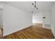 Bright living room features modern light fixture and wood flooring at 2700 Bayshore Blvd # 5307, Dunedin, FL 34698