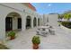 Outdoor patio area with tables, benches, and potted plants at 2700 Bayshore Blvd # 5307, Dunedin, FL 34698