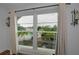 The window showcases a view of the community's pool, parking lot, and surrounding buildings at 2700 Bayshore Blvd # 5307, Dunedin, FL 34698