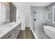 Bathroom features double sinks, modern fixtures, and a glass enclosed walk-in shower at 2812 N Massachusetts Ave, Tampa, FL 33602