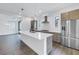 Modern kitchen with a large island, stainless steel appliances, and wood-grain cabinetry at 2812 N Massachusetts Ave, Tampa, FL 33602
