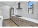Modern kitchen features stone countertops, stainless appliances, and custom cabinetry at 2812 N Massachusetts Ave, Tampa, FL 33602