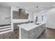 Kitchen showcases an island with quartz countertop, modern cabinetry, and pendant lighting at 2812 N Massachusetts Ave, Tampa, FL 33602