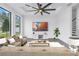 Bright living room featuring a large ceiling fan, modern furnishings, and a scenic view at 2812 N Massachusetts Ave, Tampa, FL 33602