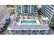 Overhead view showcases the rooftop pool, lounge area, and lush landscaping of this high-rise condominium at 301 1St S St # 1906, St Petersburg, FL 33701
