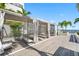 Relaxing cabanas offer shaded seating by the pool, complemented by palm trees and distant ocean views at 301 1St S St # 1906, St Petersburg, FL 33701