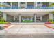 Luxurious building entrance with decorative landscaping, elegant columns, and circular lighting feature at 301 1St S St # 1906, St Petersburg, FL 33701