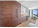 Gourmet kitchen featuring a wine fridge, custom wood cabinets, and a seamless transition to the living space at 301 1St S St # 1906, St Petersburg, FL 33701