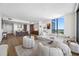 Spacious open-concept living and kitchen area with modern furnishings and floor-to-ceiling windows at 301 1St S St # 1906, St Petersburg, FL 33701