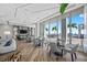 Elegant lounge area offers dining tables, comfortable seating, and expansive windows showcasing ocean views at 301 1St S St # 1906, St Petersburg, FL 33701