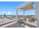 Inviting rooftop deck with lounge chairs, dining tables, umbrellas, and panoramic ocean and marina views at 301 1St S St # 1906, St Petersburg, FL 33701